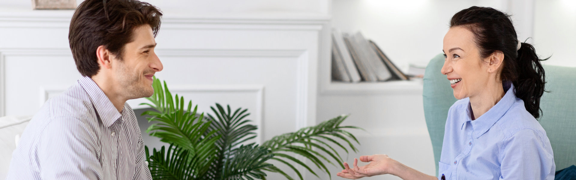 psychiatrist and patient smiling at each other