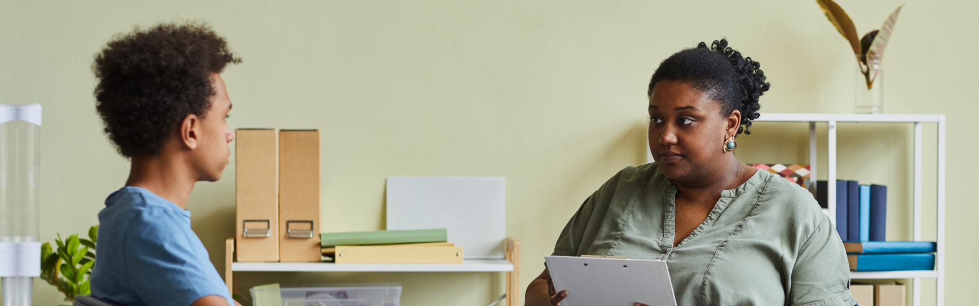 teen boy and psychiatrist having a therapy session