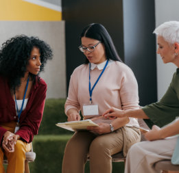 three people discussing