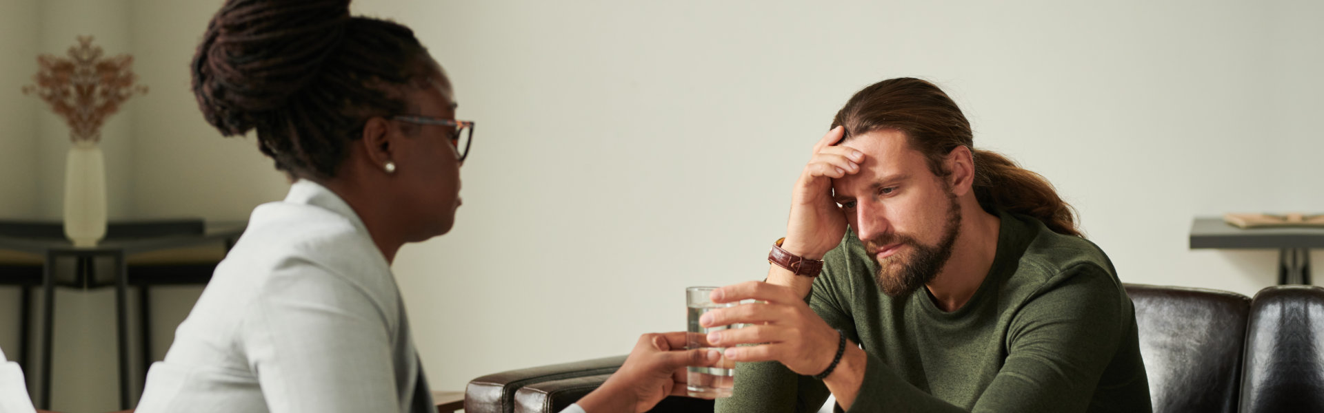 professional woman consoling the man